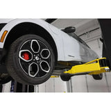 White electric car on Challenger CL12A 2-post lift with ali certified 12k capacity