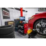 Red Coats CWA 6500 wheel aligner lifts car with black tires and silver rims