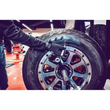 All-terrain tire on a Coats ProBalance E900 direct drive wheel balancer for pro balance