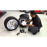 Chrome-finished multi-spoke wheel rim with black tire on Corghi OEM reverse mount kit