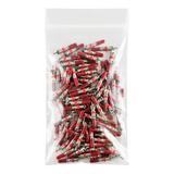 Plastic bag filled with red and silver electrical connectors or terminals.