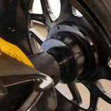 Black bicycle hub and spokes with yellow brake caliper on Ranger LS45DS laser wheel balancer