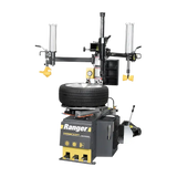 Gray and yellow Ranger R980DP tire changer with mounted tire, featuring pneumatic cylinders and dual assist arms