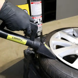 Person’s gloved hand using tire bead breaker on wheel with Ranger R980DP Tire Changer