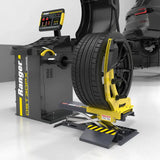 Yellow black Ranger DST30px tire balancer with wheel on RWL175 lift