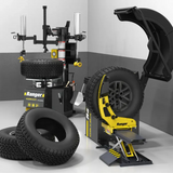 Yellow black Ranger R9002 tire changer with wheel, lug bolt flange on RWL175 lift