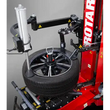Red tire changer with wheel and tire mounted for Rotary R1250 leverless r1200 changing