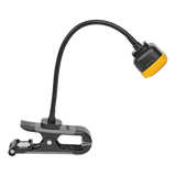 Black gooseneck LED rechargeable clamp-on work lamp with yellow base for tire repair process